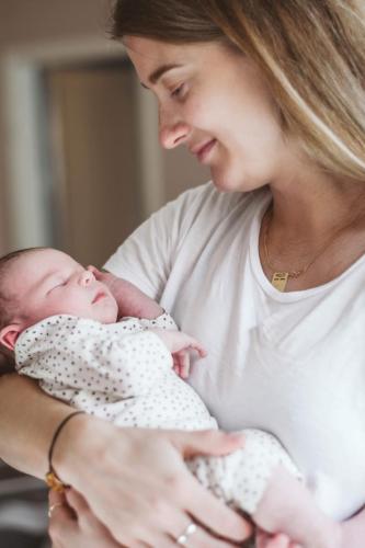 linnea holding and looking at livia
