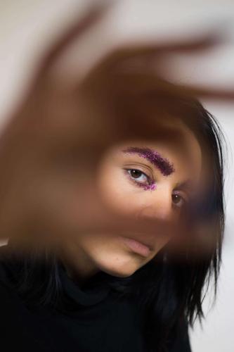 lorina looking through her hand